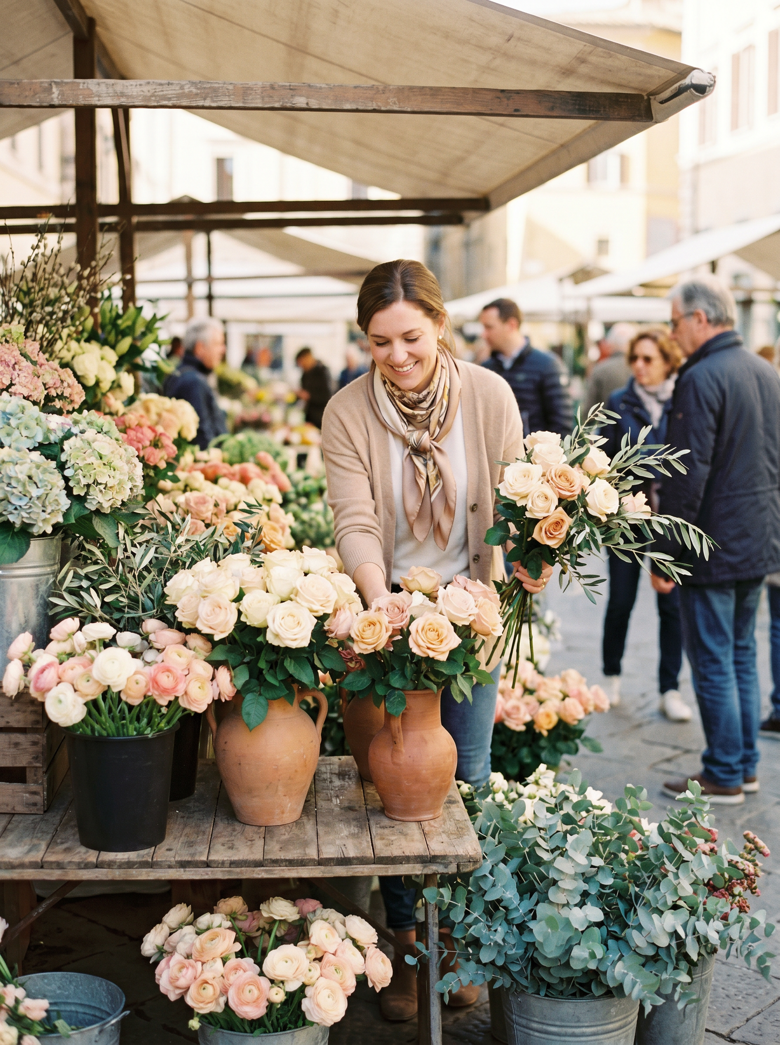 A beautiful arrangement of seasonal flowers on a wooden table in soft natural light